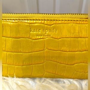 Kate Spade Embossed Yellow long leather zipped wristlet. 
Very rare and unique